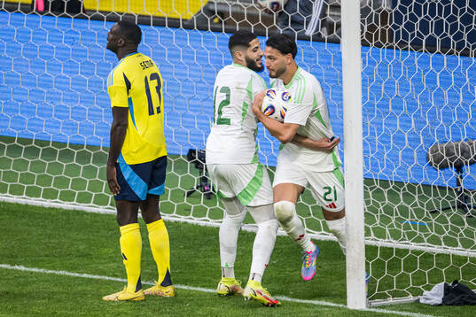 Yassine Benzia and Ramy Bensebaini of Algeria celebrate the
