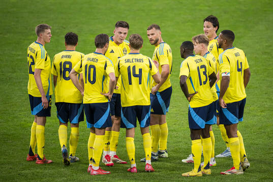Emil Holm of Sweden with team mates