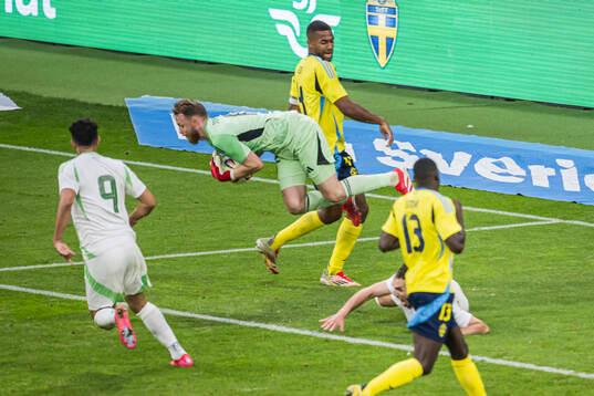 Goalkeeper Viktor Johansson and Isak Hien of Sweden