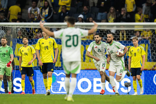 Rayan Ait Nouri and Nabil Bentaleb of Algeria celebrate the