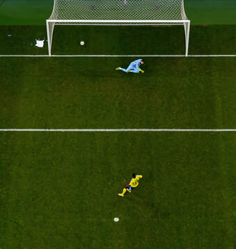 Ken Sema of Sweden scores the 3-0 goal behind goalkeeper