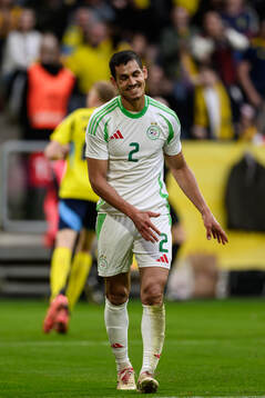 Aissa Mandi  of Algeria looks dejected