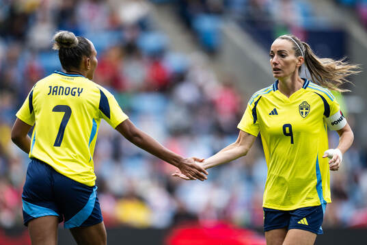 Madelen Janogy and Kosovare Asllani of Sweden