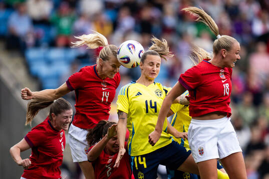 Maren Mjelde, Ada Hegerberg, Frida Maanum of Norway against