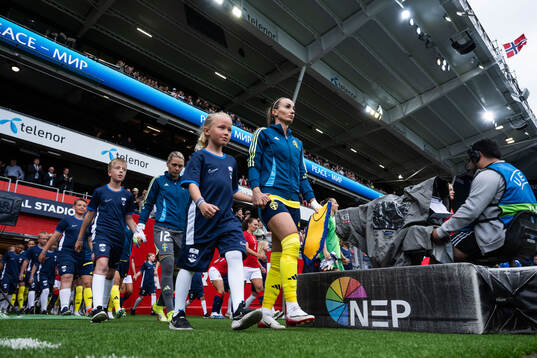 Goalkeeper Jennifer Falk and Kosovare Asllani of Sweden