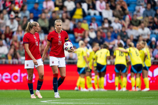 Frida Maanum and Ada Hegerberg of Norway look dejected