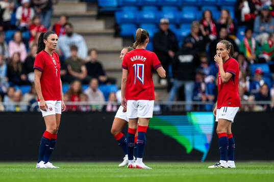 Ingrid Syrstad Engen and Guro Reiten of Norway look dejected