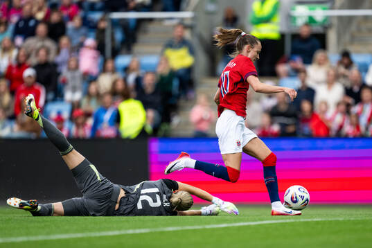 Goalkeeper Jennifer Falk of Sweden and Caroline Graham