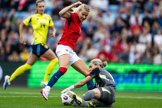 Ada Hegerberg of Norway and goalkeeper Jennifer Falk of
