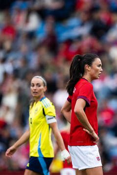 Kosovare Asllani of Sweden and Ingrid Syrstad Engen of