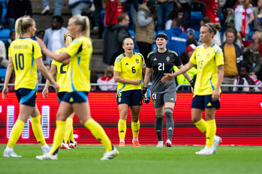 Magdalena Eriksson and goalkeeper Tove Enblom celebrate