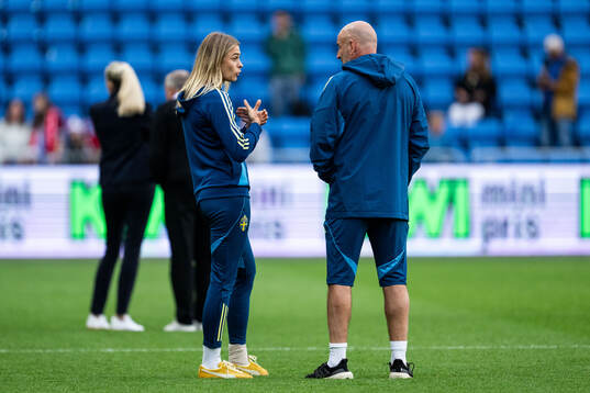 Fridolina Rolfö and assistant coach Magnus Wikman of Sweden