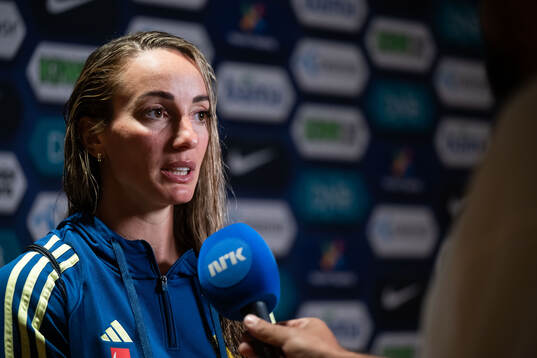 Kosovare Asllani of Sweden in mixed zone