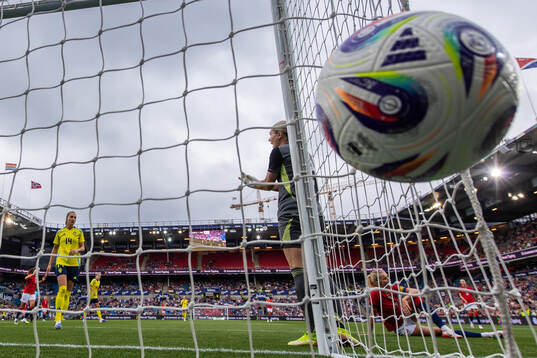 Nathalie Björna and goalkeeper Jennifer Falk of Sweden