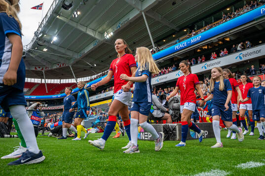 Marit Bratberg Lund of Norway enters the pitch