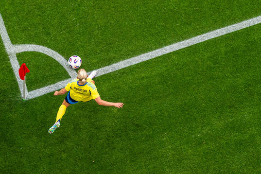 Jonna Andersson of Sweden takes a corner kick