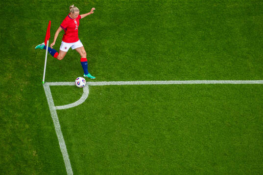 Lisa Naalsund of Norway takes a corner kick