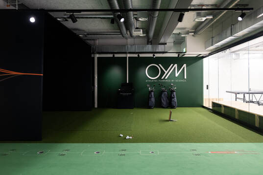A golf simulator seen at a walk around at OYM the base camp