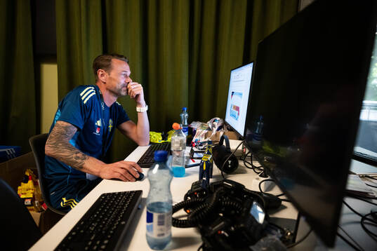 Coordinator Magnus Andersson by his computer at a walk
