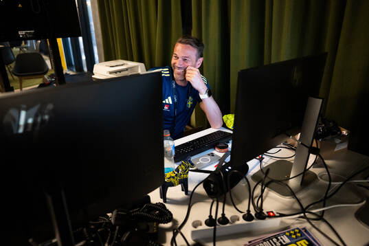 Coordinator Magnus Andersson by his computer at a walk