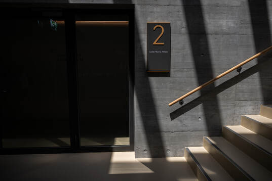 A sign for locker rooms is seen at a walk around at OYM the
