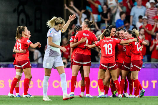 Nadine Riesen of Switzerland celebrates scoring 1-0