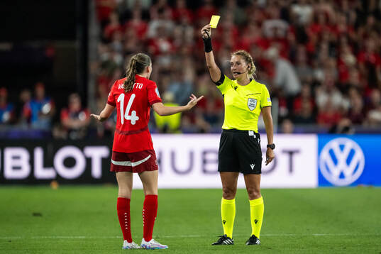 Smilla Vallotto of Switzerland receives a yellow card from