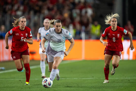 Noelle Maritz and Nadine Riesen of Switzerland chase
