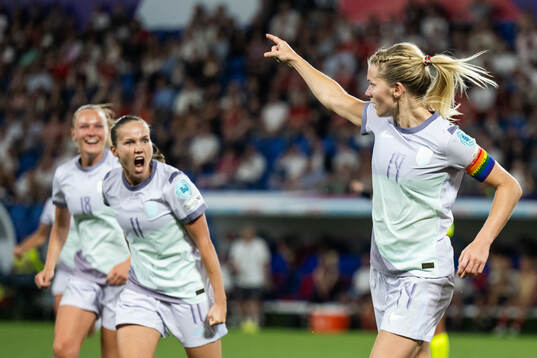 Frida Maanum and Guro Reiten celebrate with Ada Hegerberg