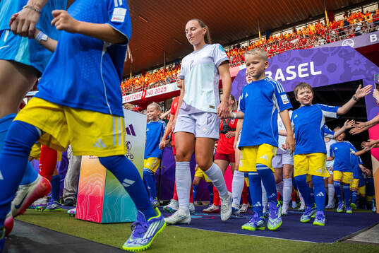 Marit Bratberg Lund of Norway enters the pitch