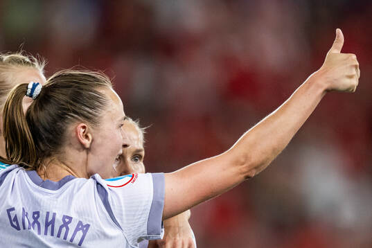 Caroline Graham Hansen and Guro Reiten of Norway celebrate