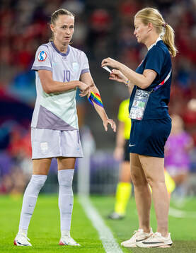 Caroline Graham Hansen of Norway gets help with the