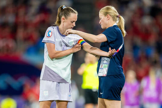Caroline Graham Hansen of Norway gets help with the