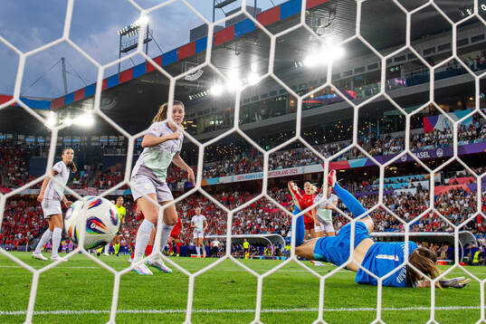 Maren Mjelde and goalkeeper Cecilie Fiskerstrand of Norway