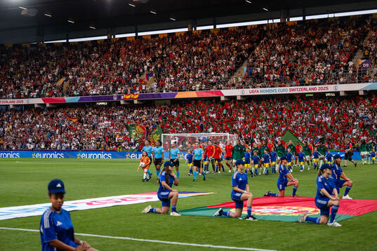 Players of Spain and of Portugal enter the arena
