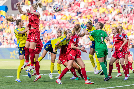 Linda Sembrant and Madelen Janogy of Sweden and goalkeeper