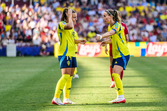 Johanna Rytting Kaneryd and Kosovare Asllani of Sweden