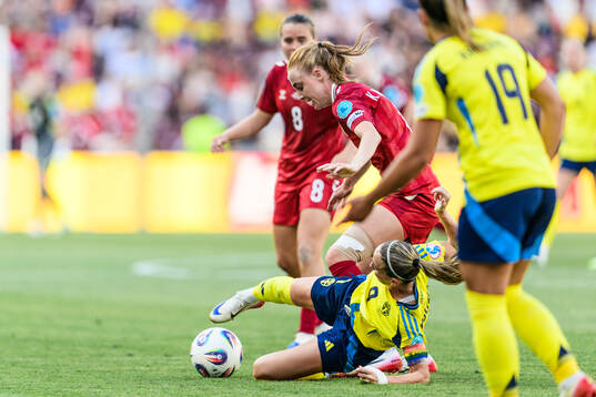 Karen Holmgaard of Denmark and Kosovare Asllani of Sweden