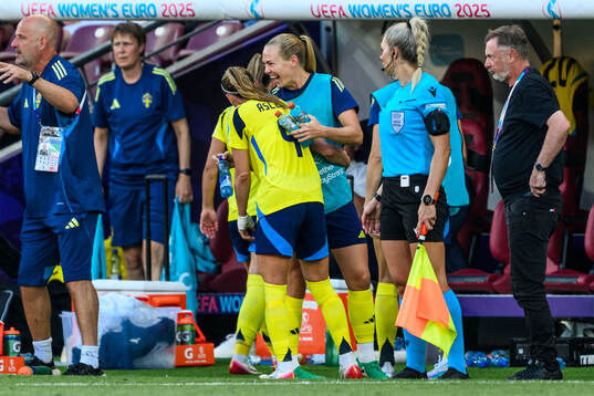 Kosovare Asllani and Magdalena Eriksson of Sweden