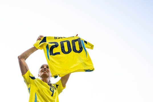 Kosovare Asllani of Sweden celebrates with a shirt marking