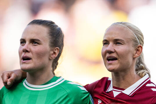 Goalkeeper Maja Bay Østergaard and Pernille Harder of