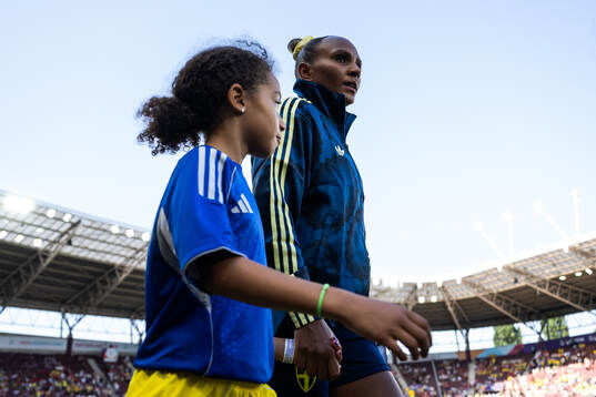 Madelen Janogy of Sweden enters the pitch