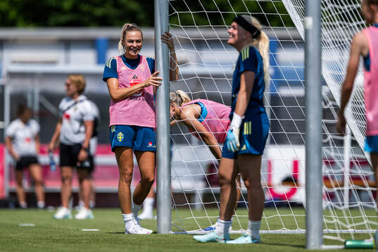 Fridolina Rolfö and goalkeeper Emma Holmgren of the