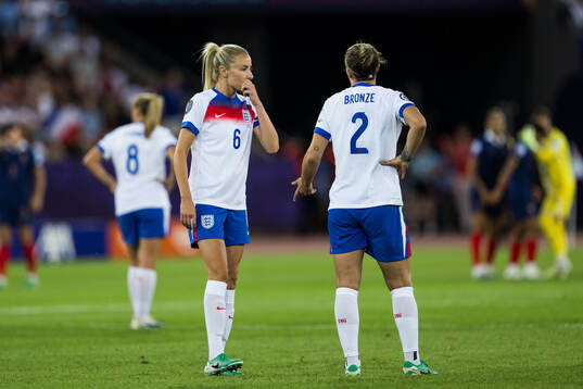 Leah Williamson and Lucy Bronze of England looks dejected