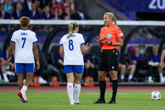 Georgia Stanway of England speaks to the referee Tess