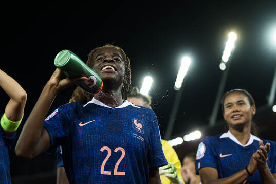 Melween N'Dongala of France celebrates afterthe UEFA