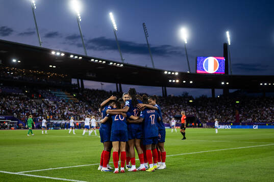 Marie Antoinette Katoto of France celebrates with team mates