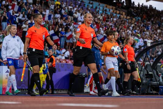 Assistant referee Almira Spahic, referee Tess Olofsson and