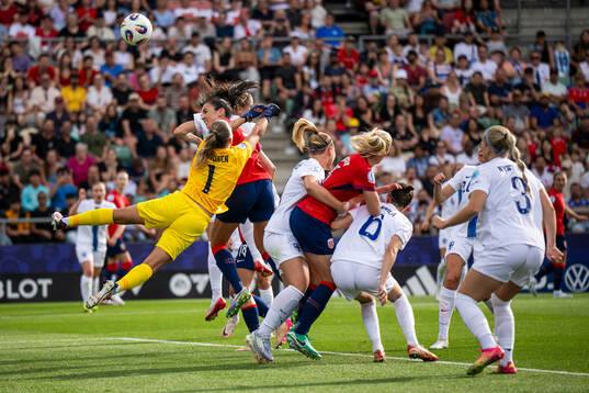 Goalkeeper Anna Koivunen of Finland and Ingrid Syrstad