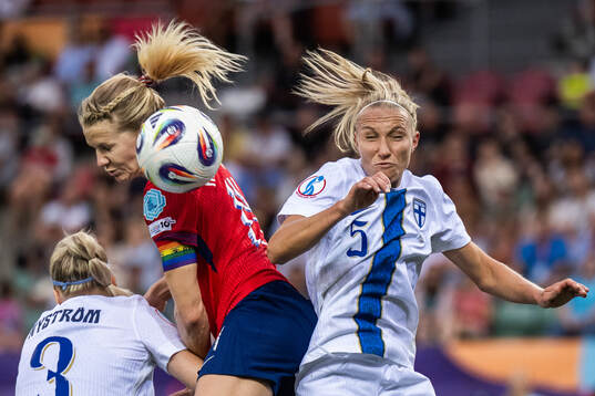 Eva Nyström and Emma Koivisto of Finland compete for the